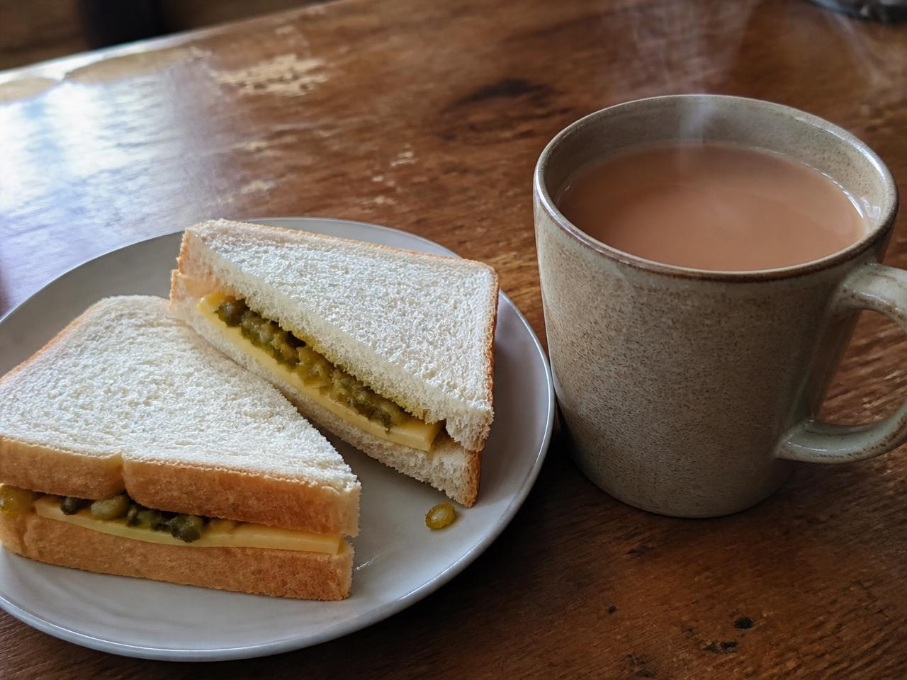 Cheese and pickle sandwich + Strong tea with milk